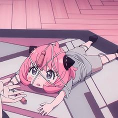 an anime character laying on the floor with pink hair