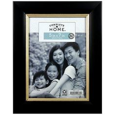 a black and gold frame with a family picture