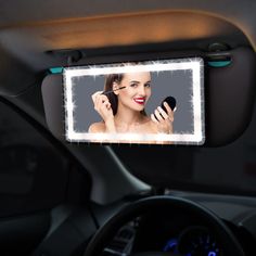 a woman is looking at her reflection in the mirror while she brushes her hair with a brush