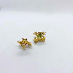 For Sale on 1stDibs - These fun frog earrings are set with .60 carats of diamonds , 1.90 carats of yellow sapphires and tsavorites and .70 carats of cabochon rubies as eyes. Frog Earrings, Yellow Sapphire, Gold Diamond, Ruby, Sapphire, Diamonds, Stud Earrings, Yellow, Gold