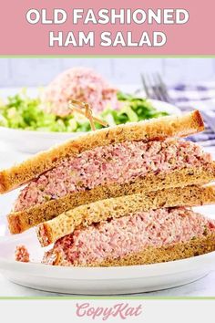 an old fashioned ham salad is cut in half and served on a plate with lettuce