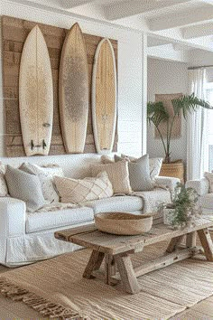 a living room filled with furniture and surfboards on the wall