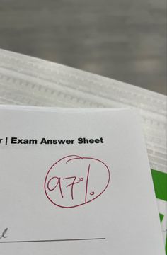 a close up of a piece of paper with an exam answer sheet in front of it