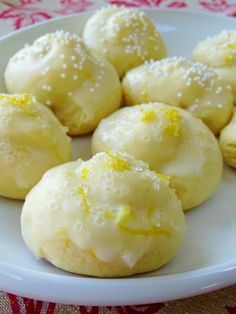 some lemon cookies are on a white plate