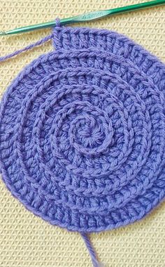 a crocheted circular is shown on the table