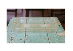 a glass dish sitting on top of a wooden table