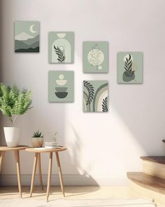 a living room with some plants and pictures on the wall