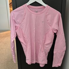 Nike Technical Long Sleeves Running Shirt. Size Small. Never Worn. Nike Long Sleeve T-shirt For Spring, Sporty Long Sleeve Pink Tops, Sporty Pink Long Sleeve Top, Nike Long Sleeve Cotton Shirt, Nike Cotton Long Sleeve Shirt, Nike Fitted Long Sleeve Tops, Nike Basic Tops For Spring, Nike Pink Long Sleeve Tops, Nike Casual Stretch Tops