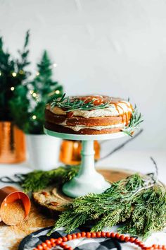 a cake sitting on top of a wooden table next to other food and decor items