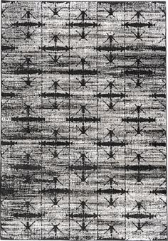 a black and white rug with an abstract design