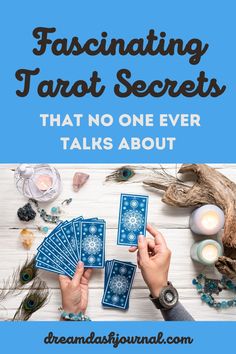 two hands holding cards with the words fascinating tarot secrets that no one ever talks about