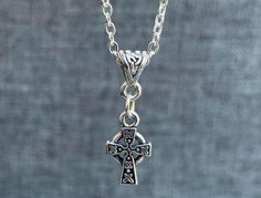 ~ Made to Order ~ Silver Plated Celtic Cross ~ Celtic Knot Bail ~ Silver Plate Satellite Chain (choose your length in drop down box) ~ Aurora Borealis Swarovski Crystals ~ Lobster Clasp Closure ~ Package: Jewelry box with Anti-tarnish cloth for easy polishing 💜 Made with CRYSTALLIZED™ - Swarovski Elements. 💜 Free USA Shipping. 💜 Matching Earrings - Follow This Link: https://www.etsy.com/listing/1155830908/celtic-cross-sterling-silver-earrings Symbolic Cross Pendant Necklace, Symbolic Cross Pendant Necklace As Gift, Symbolic Handmade Cross Pendant Necklace, Handmade Symbolic Cross Pendant Necklace, Nickel Free Spiritual Pendant Cross Necklace, Celtic Cross Necklace, Catholic Necklace, Package Jewelry, Irish Jewelry