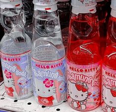 hello kitty drinks are on display in a store