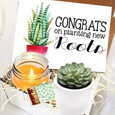 a sign that says congrats on planting new roots next to a potted plant