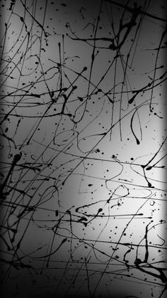 black and white photograph of water droplets on the window glass, with dark lines in the background