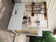 a white door and window on the side of a house with an electrical box attached to it