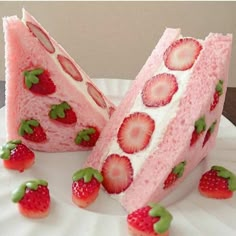 two slices of cake with strawberries on top