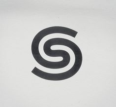 the letter s is inscribed in black on a white background