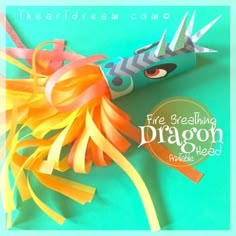 an origami fire breathing dragon made out of paper on a blue background with the title