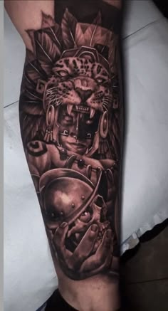 a man's arm with an image of a lion and helmet on the side