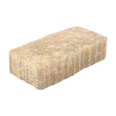 a block of hay sitting on top of a white surface