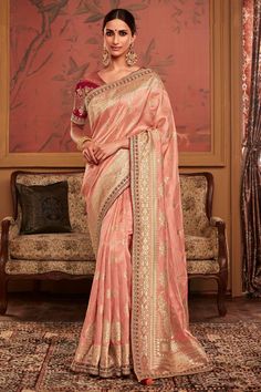 The Reach Color Wedding Wear Trendy Weaving Work Dola Silk Fabric Saree is a must-have for any fashion-conscious woman looking to add a touch of elegance to their wardrobe. The beautiful silk fabric is soft, luxurious and feels amazing against the skin, making it perfect for those special occasions when you want to look your best. The intricate weaving work on this saree is simply breathtaking, giving it a unique texture that will turn heads wherever you go. And if that's not enough, this saree also comes with an embroidered blouse that perfectly complements the stunning design of the saree. With its beautiful color and trendy style, this saree is sure to be the perfect addition to your collection. So why wait? Add this beautiful piece to your wardrobe today and step out in style! Peach Saree, Indian Designer Sarees, Green Embroidery, Designer Sarees Online, Party Kleidung, Embroidery Saree, Trendy Sarees, Work Sarees, Lace Border