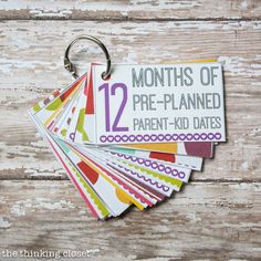 the months of pre - planned parent - kid dates are displayed on a keychain