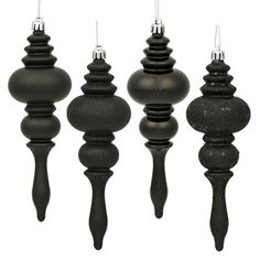 black candlesticks are lined up against a white background