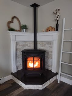 Corner mantle, corner fireplace, corner hearth, corner wood pellet stove, airstone, DIY, dyed concrete countertop hearth pad, farmhouse Corner Pellet Stove, Hearth Pad