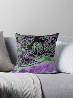 a couch with some pillows on it and one pillow has an image of a dragon