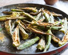 fried green beans in a frying pan on a table