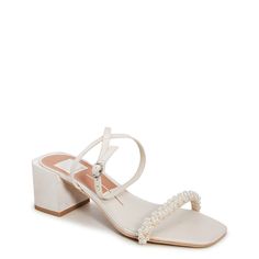 Elevate your dressy look to the next level with these women's Dolce Vita Zalima vanilla (white) heeled evening sandals. Fashioned with textile upper, these dressy sandals flaunt a trendy square open toe, appealing decorative faux pearl beads at the toe strap, and an adjustable ankle strap with buckle closure for that perfect fit. The synthetic outsole with covered block heel completes the look. | Dolce Vita Women's Zalima Evening Sandal in Vanilla Size 6 Medium Dressy Sandals, Evening Sandals, Dolce Vita Shoes, Pearl Beads, Wedge Heels, Wedge Sandals, Women's Shoes Sandals, Faux Pearl, Block Heels