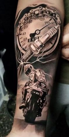 a man's arm with a motorcycle and speedometer on it