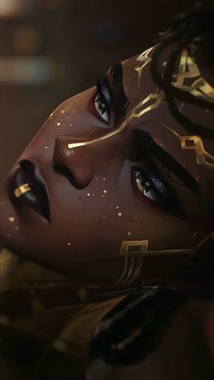 a close up of a woman's face with gold paint on her face and eyes