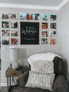 a chair in front of a wall with pictures on it and a sign that says welcome