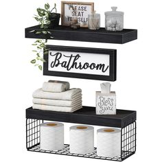 two shelves with towels, toilet paper and other bathroom items on top of each shelf