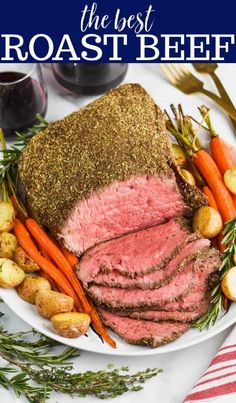 the best roast beef with carrots, potatoes and parsley on a white plate