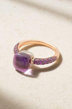 Pomellato's 'Nudo Classic' ring shimmers in gorgeous, regal shades of purple. Cast from rhodium-plated 18-karat rose and white gold, it's set with a faceted amethyst and layered with a 4.90-carat jade. 32 smaller amethysts stud the band, enhancing the other stones' natural beauty. Luxury Rose Gold Rings With Accent Stones, Luxury Multi-stone Amethyst Wedding Ring, Luxury Pink Amethyst Ring For Formal Occasions, Luxury Multi-stone Amethyst Ring For Weddings, Elegant Cushion Cut Yellow Gold Amethyst Ring, Luxury White Gold Amethyst Ring With Gemstone Accents, Luxury Multi-stone Amethyst Ring For Formal Occasions, Luxury Amethyst Cushion Cut Ring For Formal Events, Luxury Amethyst Cushion Cut Ring For Formal Occasions