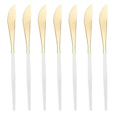 six gold and white toothbrushes in different sizes