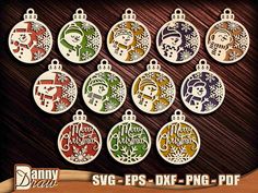 twelve christmas ornament ornaments in different colors and sizes on a wooden background with the word