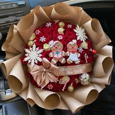 a bouquet of flowers in the shape of a teddy bear and snowflakes