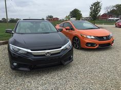 two cars parked next to each other in a parking lot