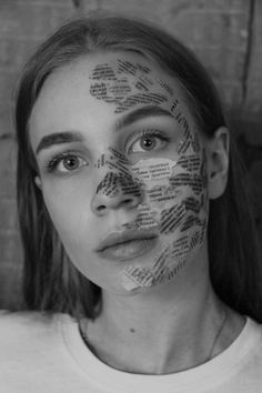 a woman with words all over her face