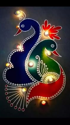 an artistic painting on the wall with lights and candles in it, depicting two peacocks