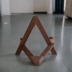 a wooden object sitting on the floor in a room