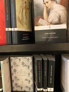 there are many books on the shelves in this library, including one for jane austen