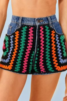 a close up of a woman's shorts with crochet on the bottom