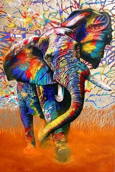 an elephant is painted with multicolors and has tusks on it's head