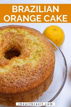 a close up of a cake on a plate with oranges and lemons in the background