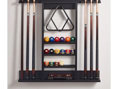 billiards rack with pool balls and cues hanging on it's wall